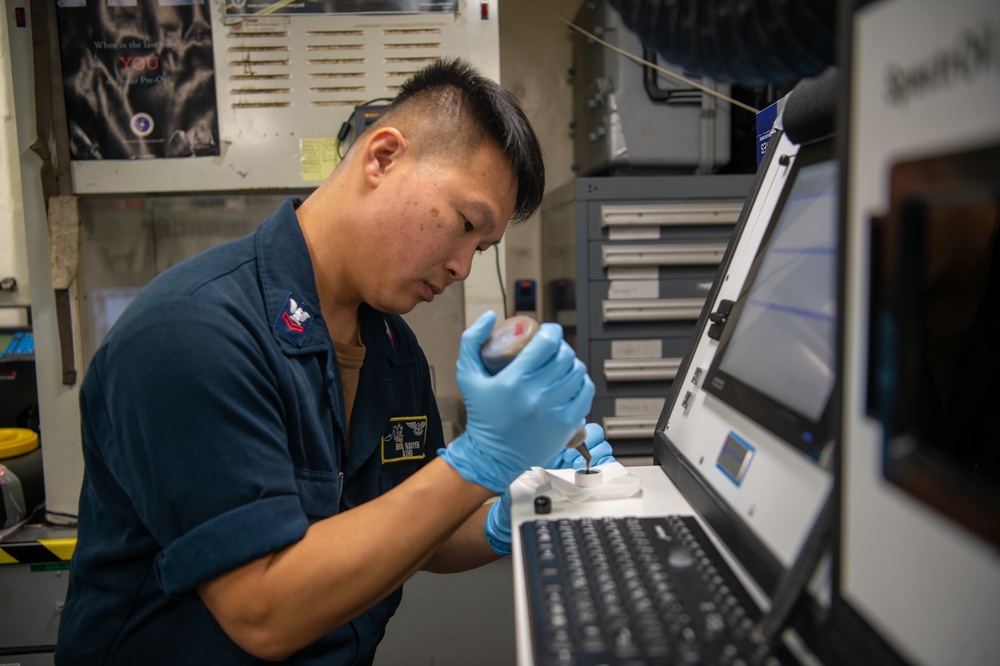 U.S. Navy Sailor Tests Oil Samples