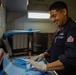 U.S. Navy Sailor Packs Dental Instruments