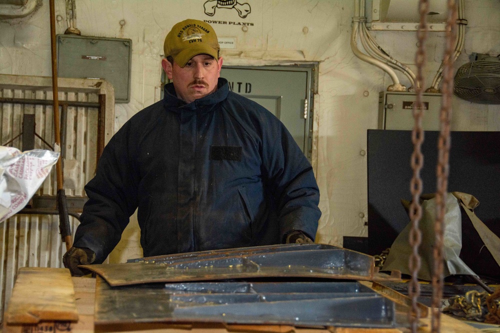 USS Ronald Reagan (CVN 76) AIMD Sailors conduct maintenance in the jet shop