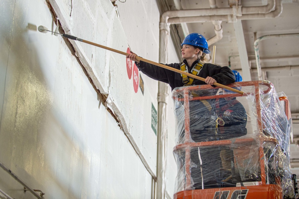 USS Ronald Reagan (CVN 76) Sailors perform maintenance