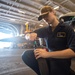 U.S. Navy Sailor Repairs Aircraft Auxiliary Equipment