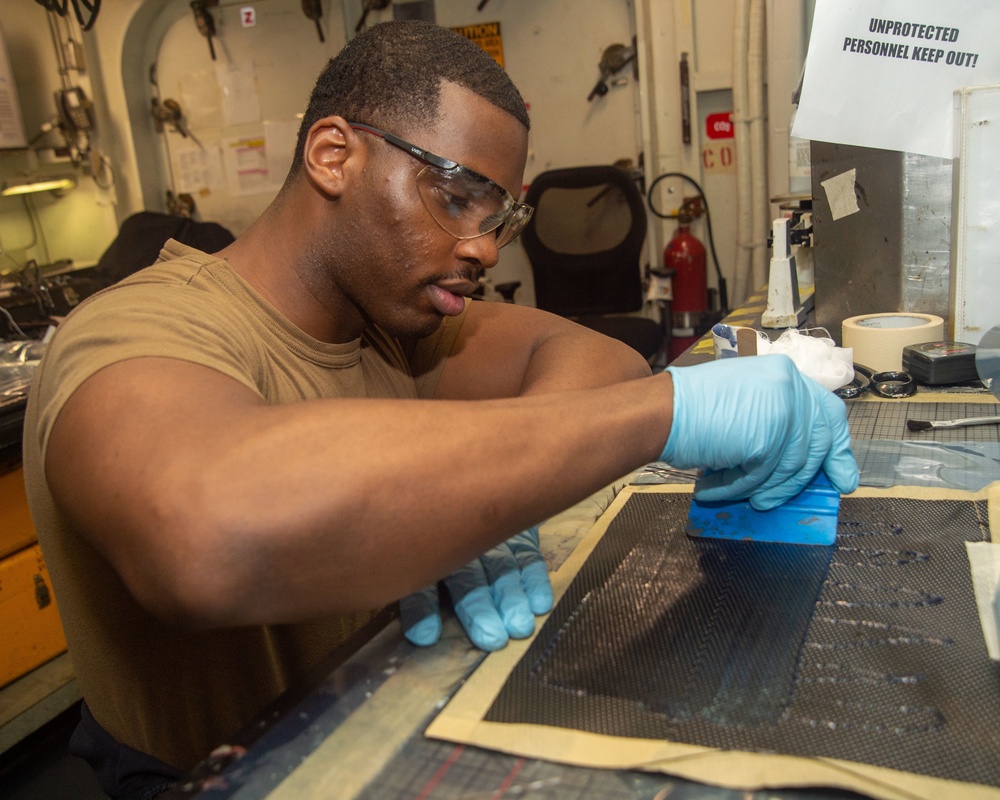 Sailor Treats A Carbon Fiber Sheet With Adhesive