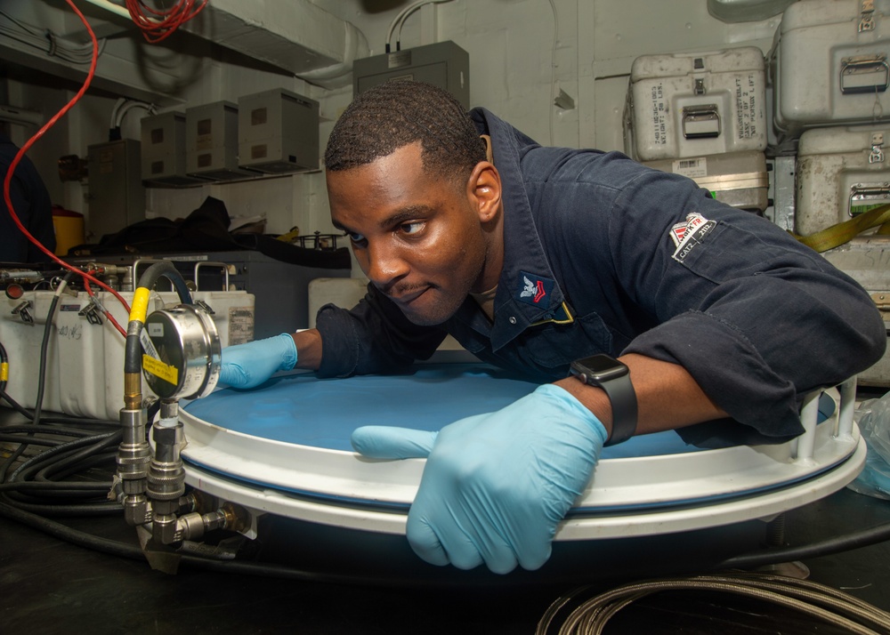 Sailor Places Adhesive-laden Carbon Fiber Plies Under Vacuum