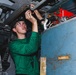 Sailor Performs Helicopter Maintenance