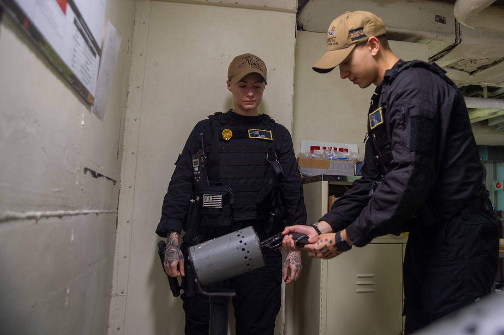 U.S. Navy Sailors Perform Weapon Clearing Procedures