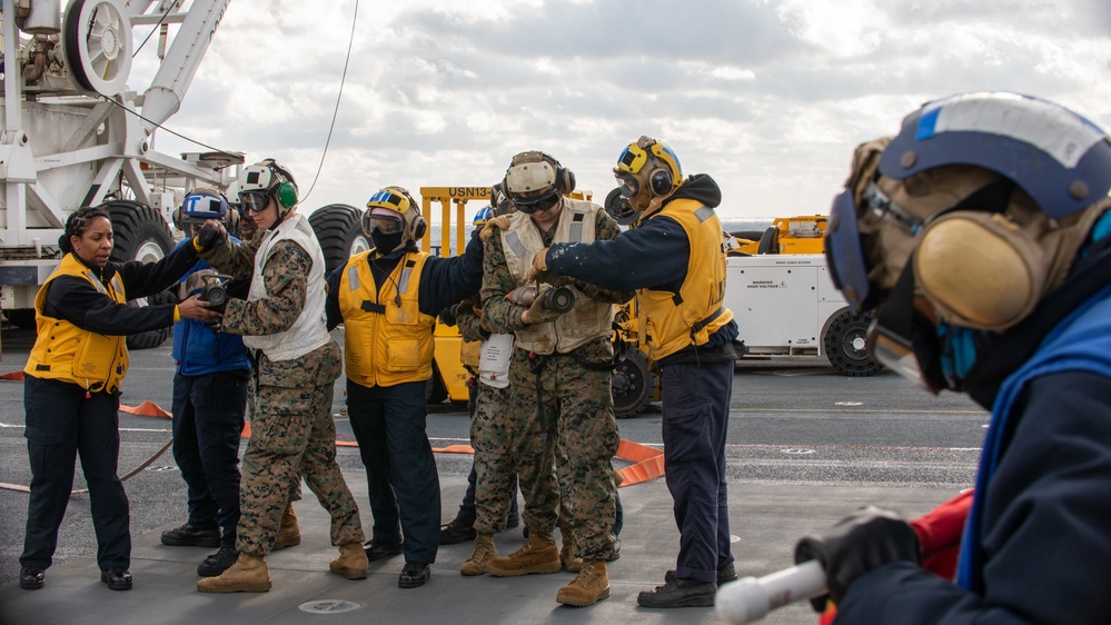 USS BATAAN SAILORS CONDUCT FLIGHT DECK FIRE DRILL