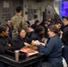 USS BATAAN CSADD SAILORS HOST GINGERBREAD BUILDING