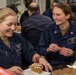 USS BATAAN CSADD SAILORS HOST GINGERBREAD BUILDING