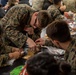 USS BATAAN CSADD SAILORS HOST GINGERBREAD BUILDING