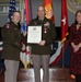Col. Scott Bird, NETCOM Deputy Commander for Operations, receives his retirement certificate