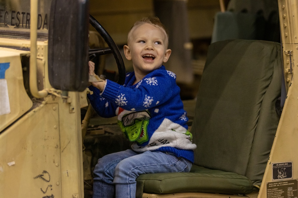 Polish Child gets to look and interact with a HMMWV