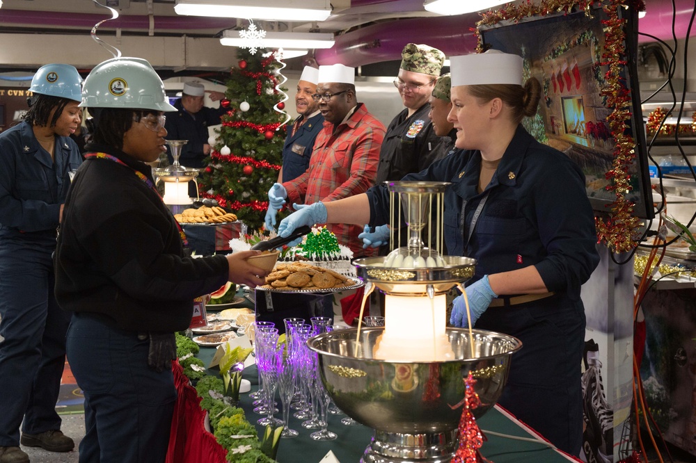 U.S. Sailors share a Christmas meal