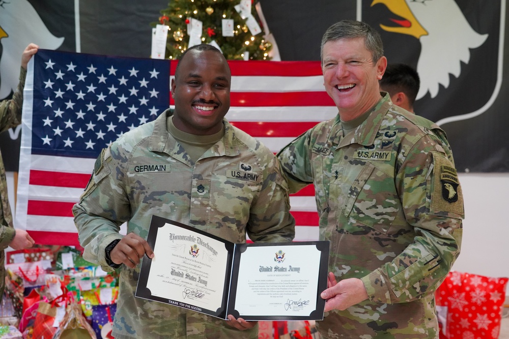 Staff Sgt. Travis Germain reenlists during rotation overseas