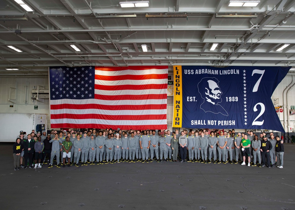 Abraham Lincoln hosts a Holiday Bowl ship tour.