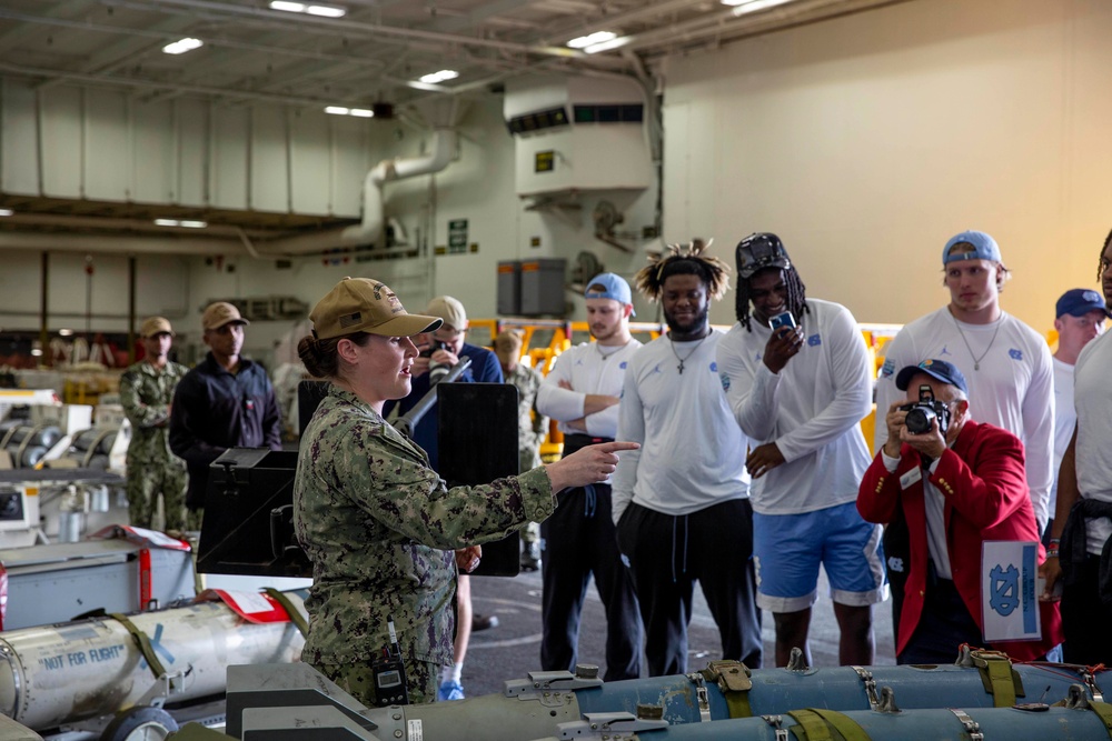 Abraham Lincoln hosts a Holiday Bowl ship tour.