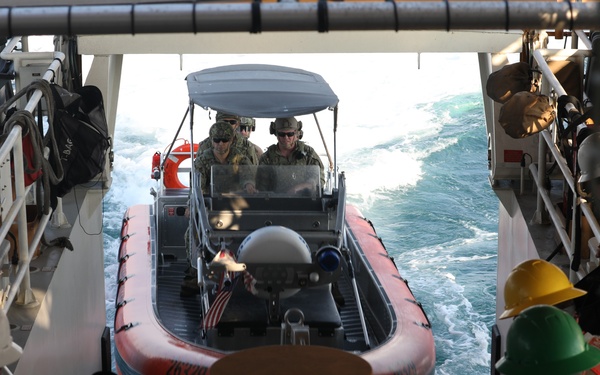 USCGC Charles Moulthrope recovers its small boat after training exercises in the Arabian Gulf