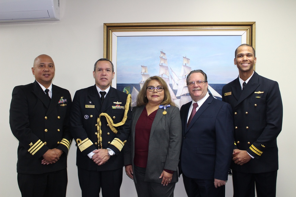 NAVSUP FLC San Diego employee Rosa Downing receives award from Brazilian Naval Attaché, Rear Admiral Rogerio Pinto Ferreira Rodrigues, on Dec 13.