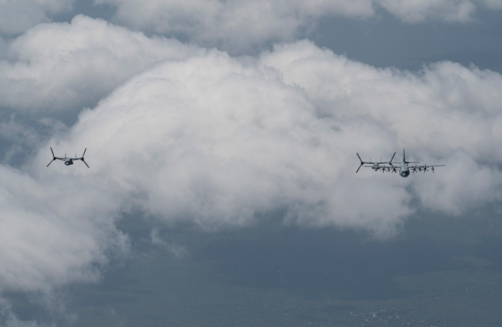 Two KC-130J Super Hercules conduct TAAR with MV-22 Ospreys within HOA