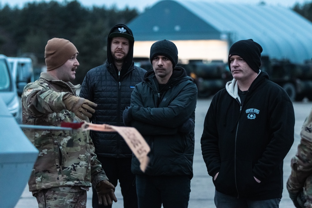 U.S. Army Soldier shows Jerrod Niemann around the 33rd Air Base Powidz, Poland