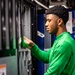 U.S. Navy Sailor Restocks Vending Machine