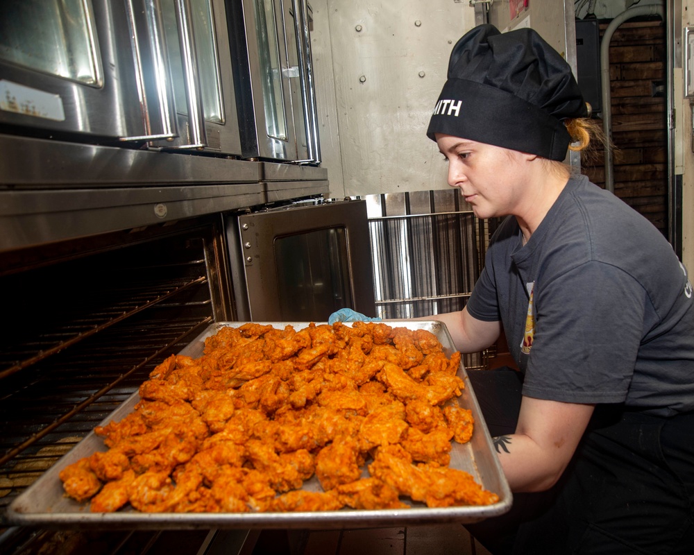 Sailor Loads Chicken Into Oven