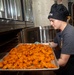 Sailor Loads Chicken Into Oven