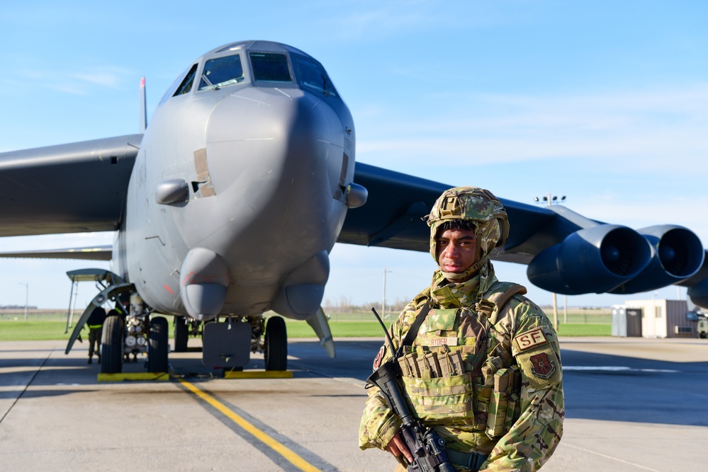 5th Security Forces Squadron Defender, guards military asset.