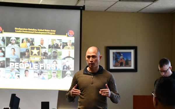 Lt. Col. Jay Bao addresses Headquarters Battalion Soldiers