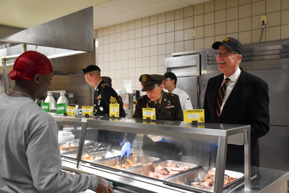 Senator Moran, Brig. Gen. Knell serving Thanksgiving meals to Soldiers