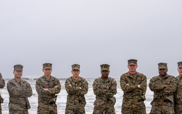 First Marine Corps District awards, reenlists Sgt. Kokou D. Adjogble