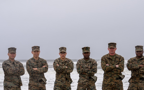 First Marine Corps District awards, reenlists Sgt. Kokou D. Adjogble