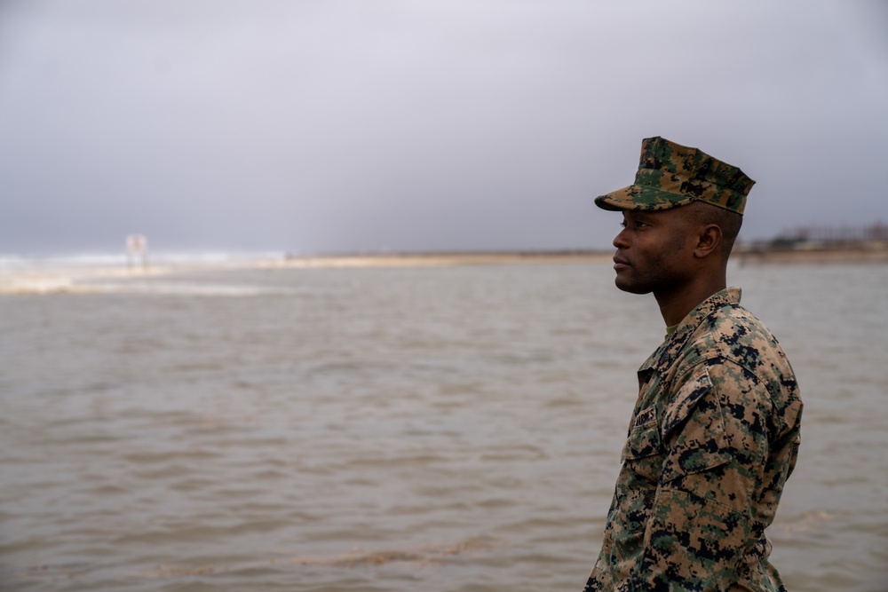 First Marine Corps District awards, reenlists Sgt. Kokou D. Adjogble