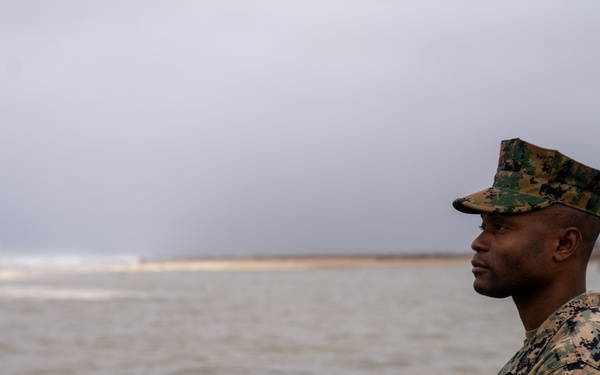 First Marine Corps District awards, reenlists Sgt. Kokou D. Adjogble