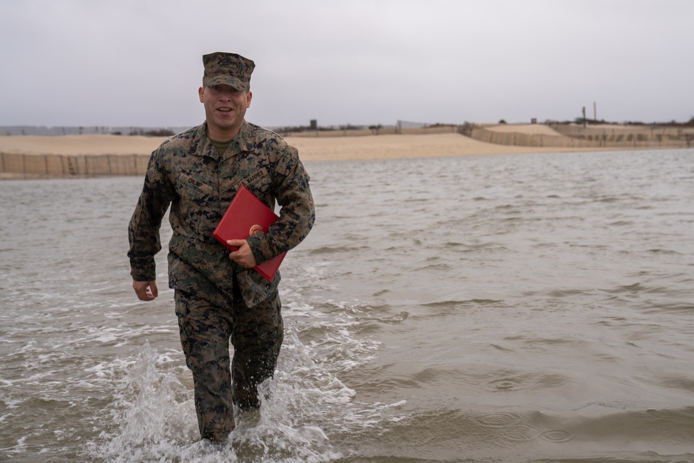 First Marine Corps District awards, reenlists Sgt. Kokou D. Adjogble