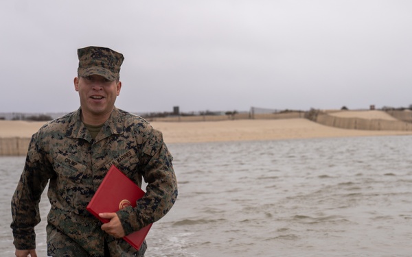 First Marine Corps District awards, reenlists Sgt. Kokou D. Adjogble