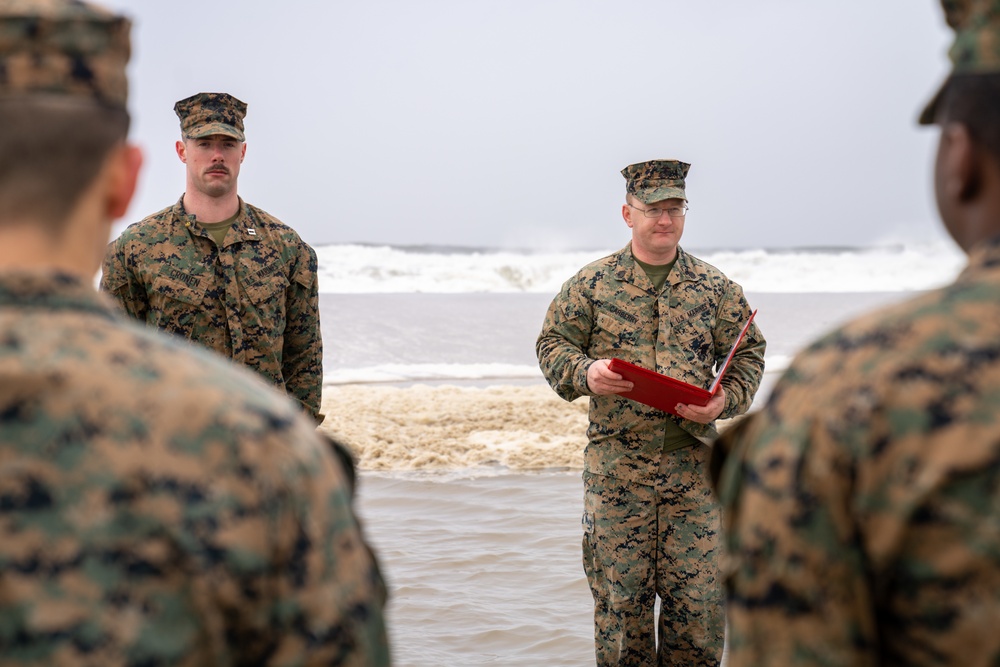 First Marine Corps District awards, reenlists Sgt. Kokou D. Adjogble