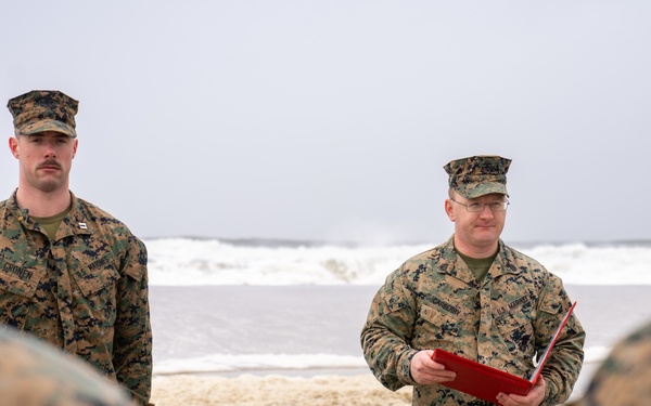 First Marine Corps District awards, reenlists Sgt. Kokou D. Adjogble