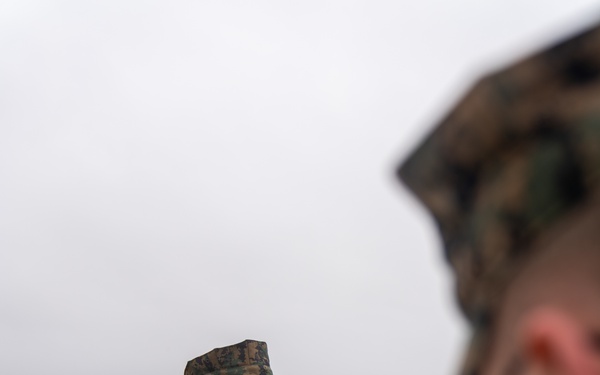 First Marine Corps District awards, reenlists Sgt. Kokou D. Adjogble