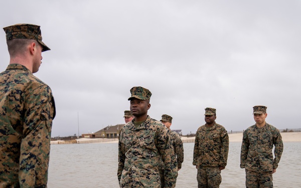 First Marine Corps District awards, reenlists Sgt. Kokou D. Adjogble