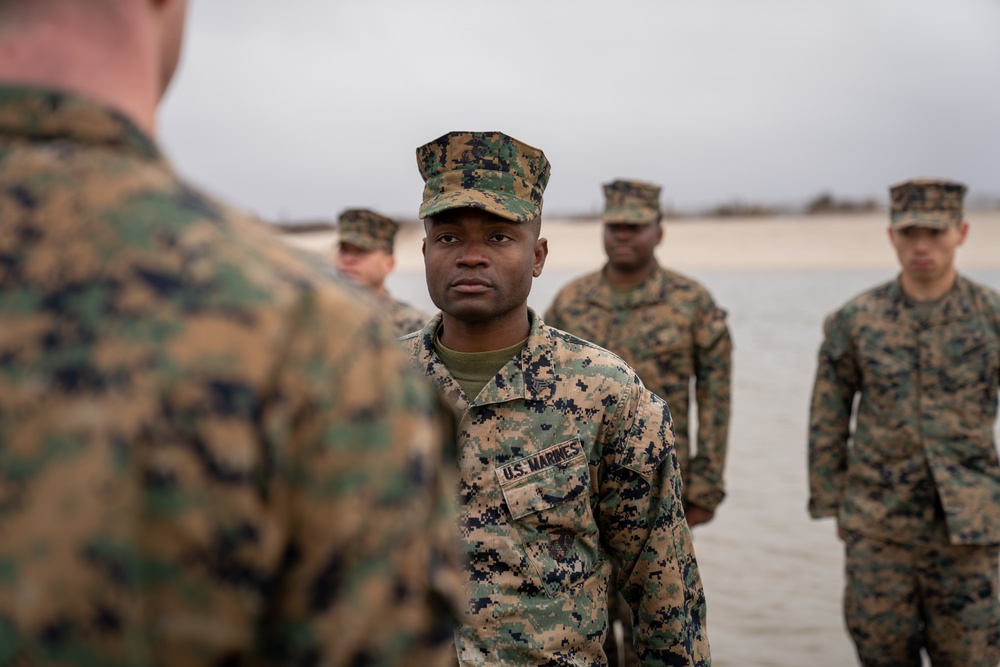 First Marine Corps District awards, reenlists Sgt. Kokou D. Adjogble