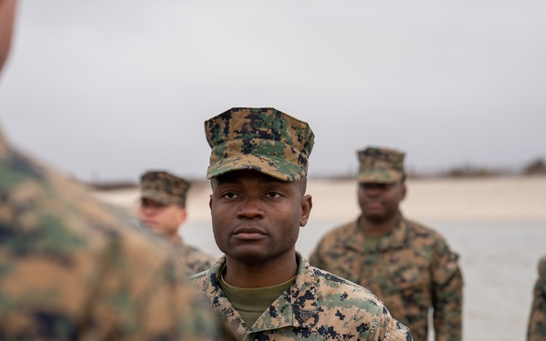 First Marine Corps District awards, reenlists Sgt. Kokou D. Adjogble