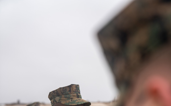 First Marine Corps District awards, reenlists Sgt. Kokou D. Adjogble