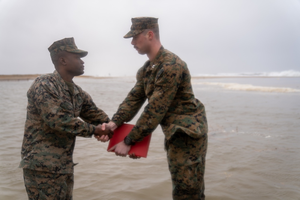 First Marine Corps District awards, reenlists Sgt. Kokou D. Adjogble