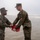 First Marine Corps District awards, reenlists Sgt. Kokou D. Adjogble