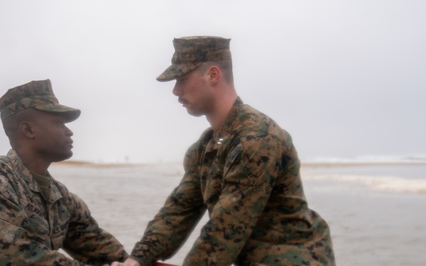 First Marine Corps District awards, reenlists Sgt. Kokou D. Adjogble