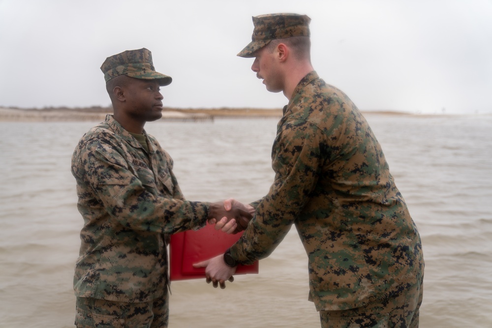 First Marine Corps District awards, reenlists Sgt. Kokou D. Adjogble