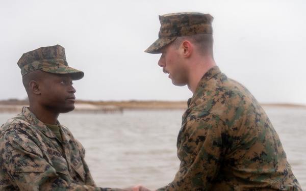 First Marine Corps District awards, reenlists Sgt. Kokou D. Adjogble