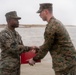 First Marine Corps District awards, reenlists Sgt. Kokou D. Adjogble