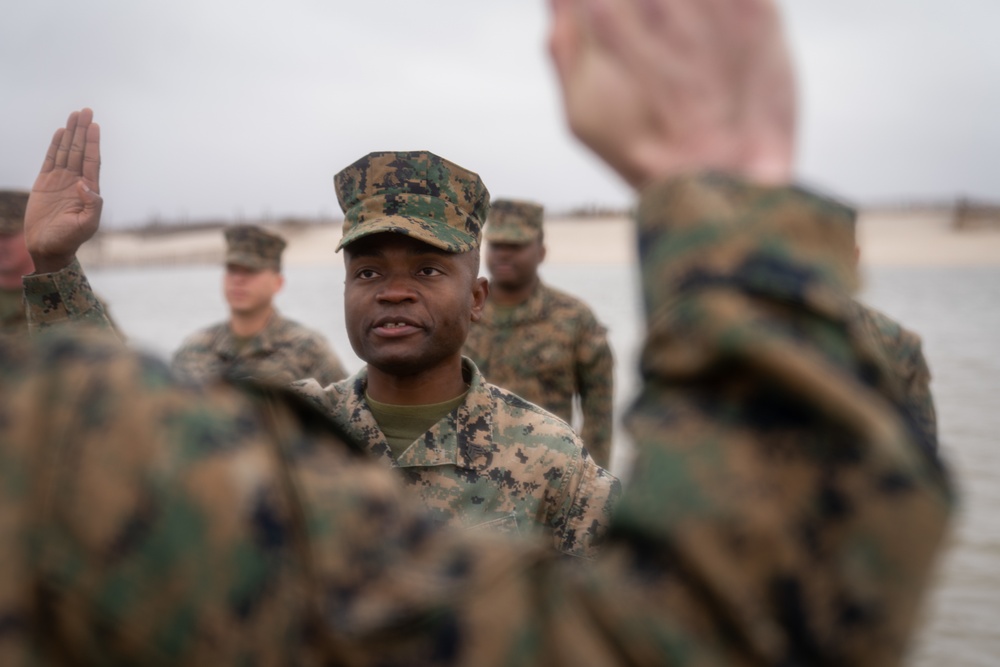 First Marine Corps District awards, reenlists Sgt. Kokou D. Adjogble