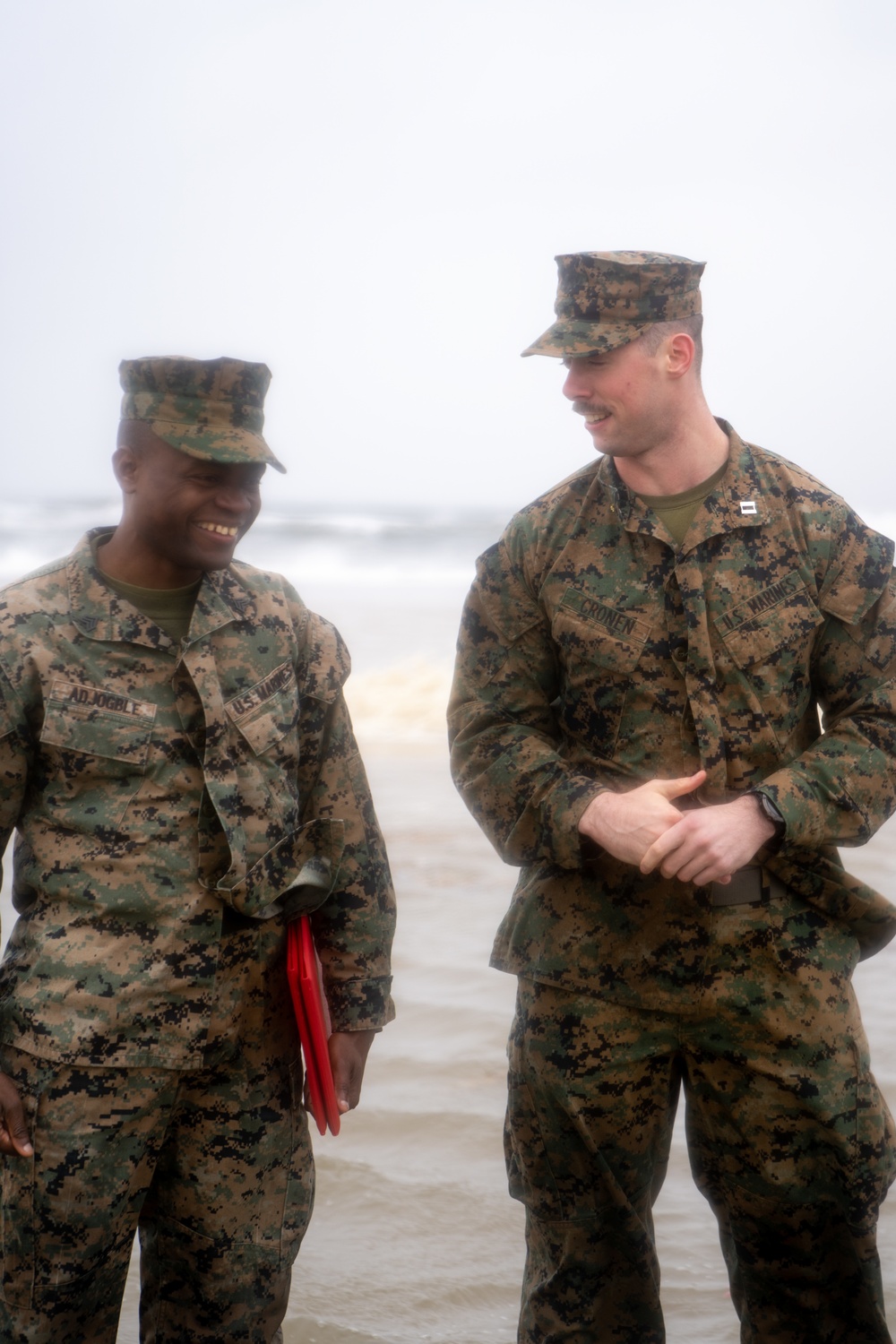 First Marine Corps District awards, reenlists Sgt. Kokou D. Adjogble